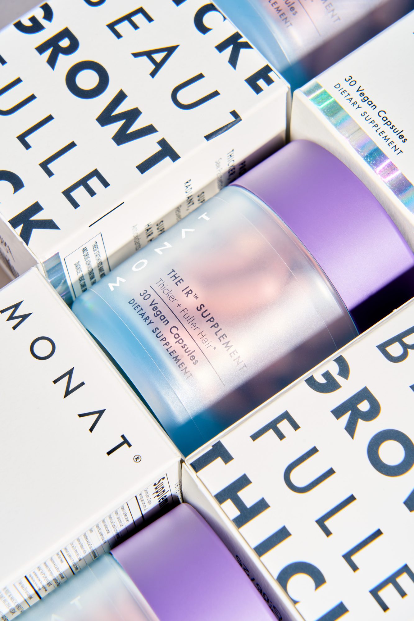 The IR Supplement — Frosted bottle, violet cap: the piece that stays on the counter.